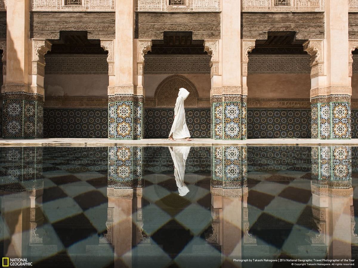Marrakesh is an exciting city for any traveler, but I was tired of walking on the crowded street and being asked for money from local people, so I was looking for a place to settle down. Even though there were a lot of people in Madrasa, it was still a more quiet and relaxing place than outside. Suddenly a beautiful reflection appeared on the shallow pool when I was taking a rest. It was a cloudy day so I could only see it when the wind stopped blowing and sunlight hit this Islamic architecture. | CATEGORY: Cities